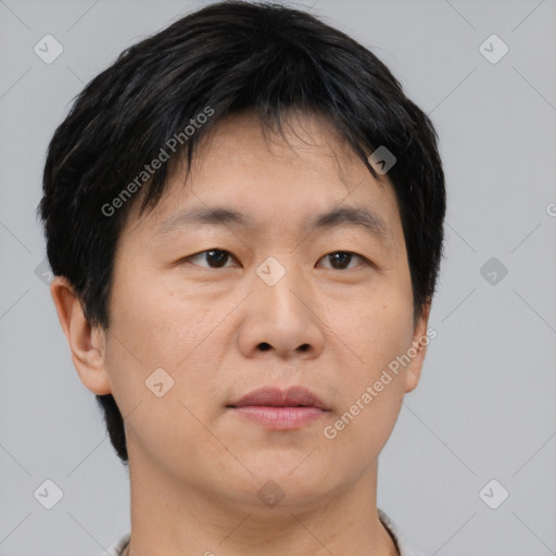 Neutral asian young-adult male with short  brown hair and brown eyes