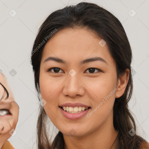 Joyful latino young-adult female with long  brown hair and brown eyes