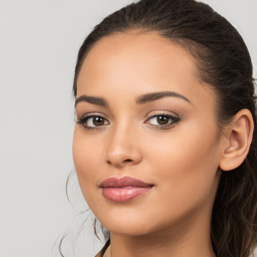 Joyful white young-adult female with long  brown hair and brown eyes