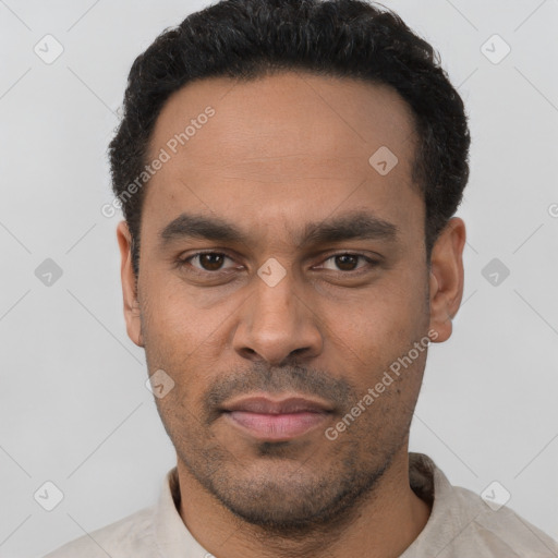 Neutral latino young-adult male with short  black hair and brown eyes