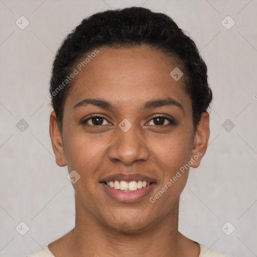 Joyful latino young-adult female with short  black hair and brown eyes