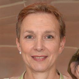 Joyful white adult female with short  brown hair and brown eyes