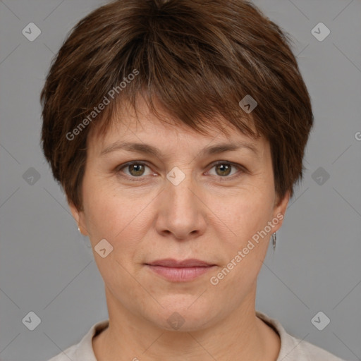 Joyful white adult female with short  brown hair and brown eyes