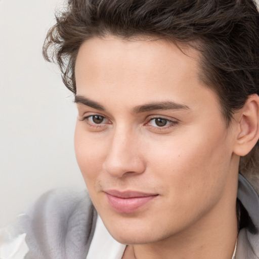 Joyful white young-adult male with medium  brown hair and brown eyes