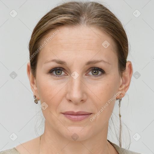 Joyful white adult female with medium  brown hair and grey eyes