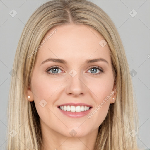 Joyful white young-adult female with long  brown hair and blue eyes