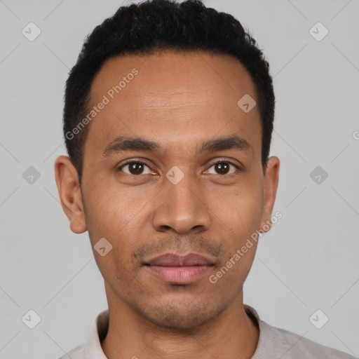 Joyful latino young-adult male with short  black hair and brown eyes