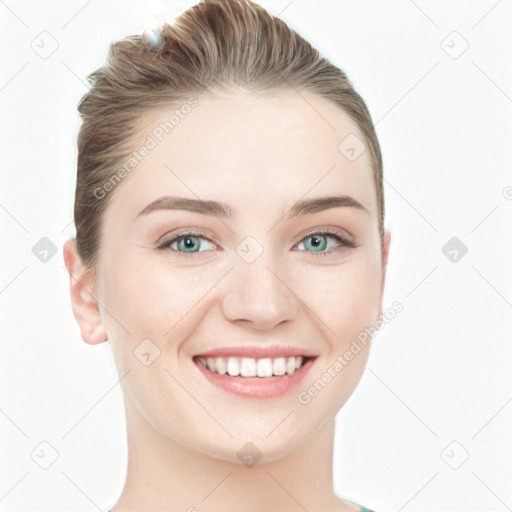 Joyful white young-adult female with short  brown hair and blue eyes