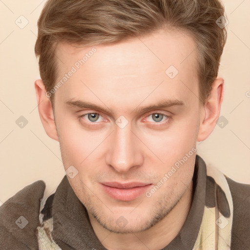 Joyful white young-adult male with short  brown hair and grey eyes