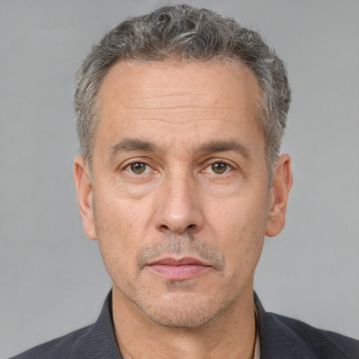 Neutral white middle-aged male with short  brown hair and brown eyes