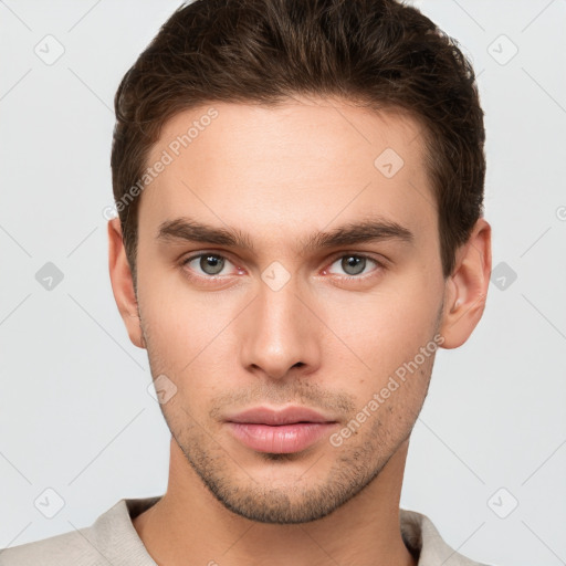 Neutral white young-adult male with short  brown hair and grey eyes