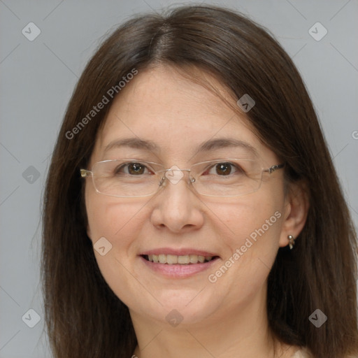 Joyful white adult female with long  brown hair and grey eyes