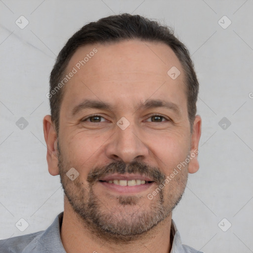 Joyful white adult male with short  brown hair and brown eyes