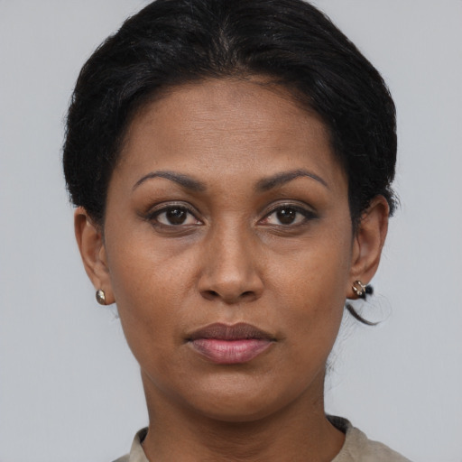 Neutral black adult female with short  brown hair and brown eyes