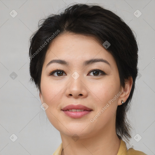 Joyful asian young-adult female with medium  brown hair and brown eyes