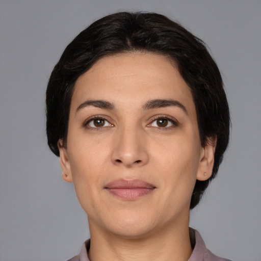 Joyful white young-adult female with medium  black hair and brown eyes
