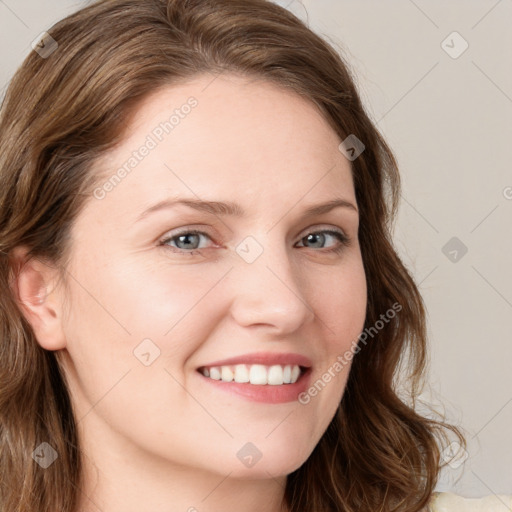 Joyful white young-adult female with long  brown hair and blue eyes