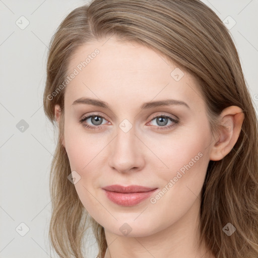 Joyful white young-adult female with long  brown hair and blue eyes