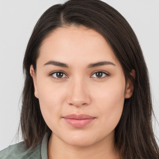 Joyful white young-adult female with long  brown hair and brown eyes