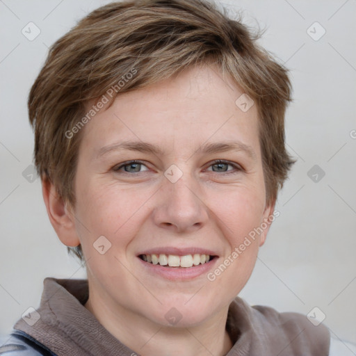 Joyful white young-adult female with short  brown hair and grey eyes