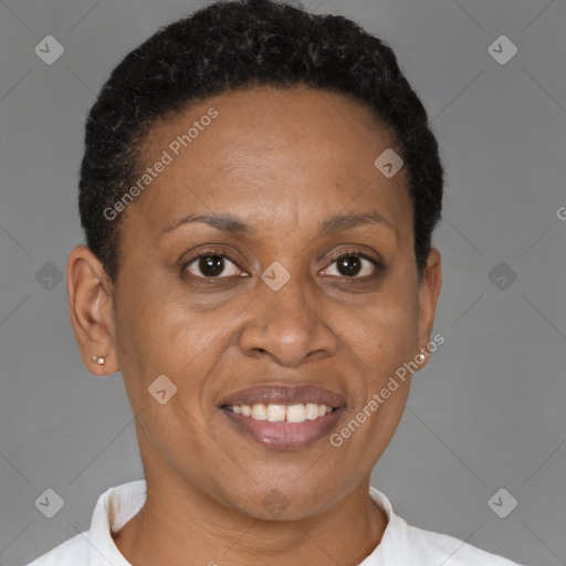 Joyful black adult female with short  brown hair and brown eyes