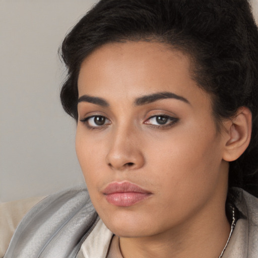 Neutral latino young-adult female with long  brown hair and brown eyes