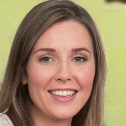 Joyful white young-adult female with long  brown hair and green eyes