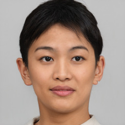 Joyful asian young-adult female with short  brown hair and brown eyes