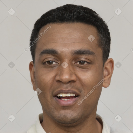 Joyful black young-adult male with short  black hair and brown eyes