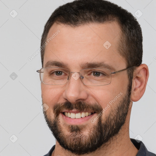 Joyful white adult male with short  brown hair and brown eyes