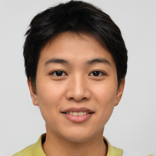 Joyful asian young-adult female with short  brown hair and brown eyes