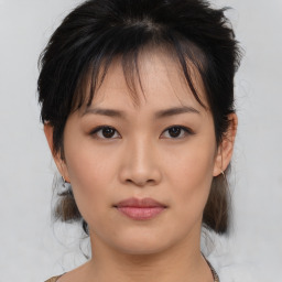 Neutral asian young-adult female with medium  brown hair and brown eyes