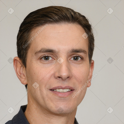 Joyful white adult male with short  brown hair and brown eyes