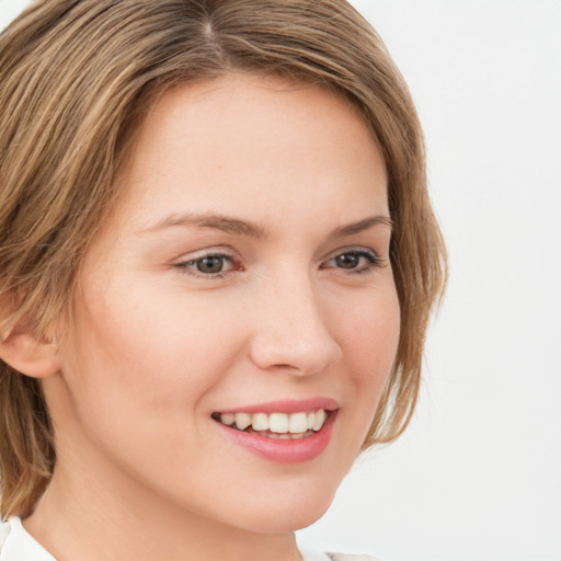 Joyful white young-adult female with medium  brown hair and blue eyes