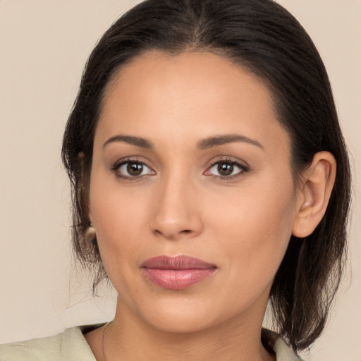 Joyful white young-adult female with medium  brown hair and brown eyes