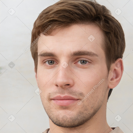 Neutral white young-adult male with short  brown hair and grey eyes