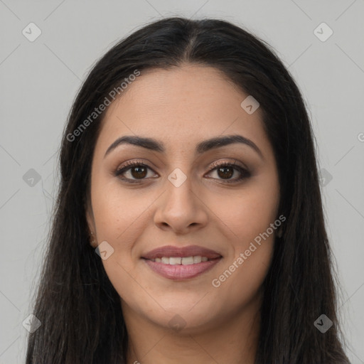 Joyful latino young-adult female with long  brown hair and brown eyes