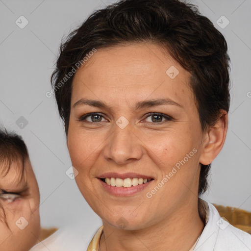 Joyful white adult female with medium  brown hair and brown eyes