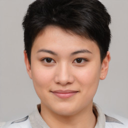 Joyful asian young-adult female with short  brown hair and brown eyes