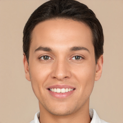 Joyful white young-adult male with short  brown hair and brown eyes