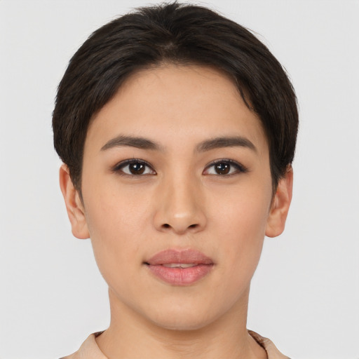 Joyful asian young-adult female with short  brown hair and brown eyes