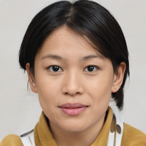 Joyful asian young-adult female with medium  brown hair and brown eyes