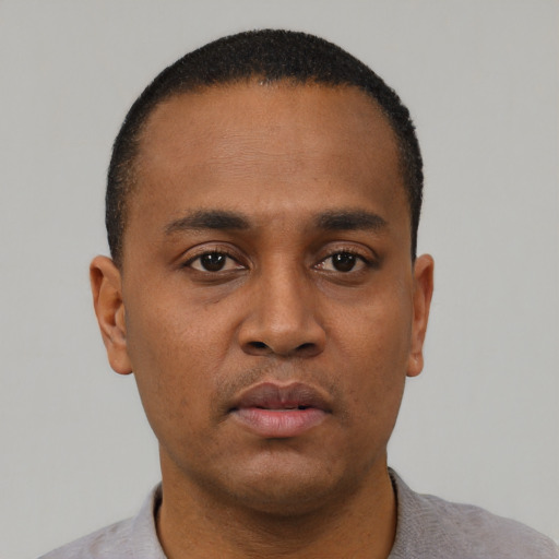 Neutral black young-adult male with short  black hair and brown eyes