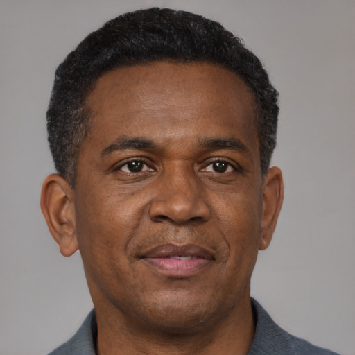 Neutral black adult male with short  brown hair and brown eyes