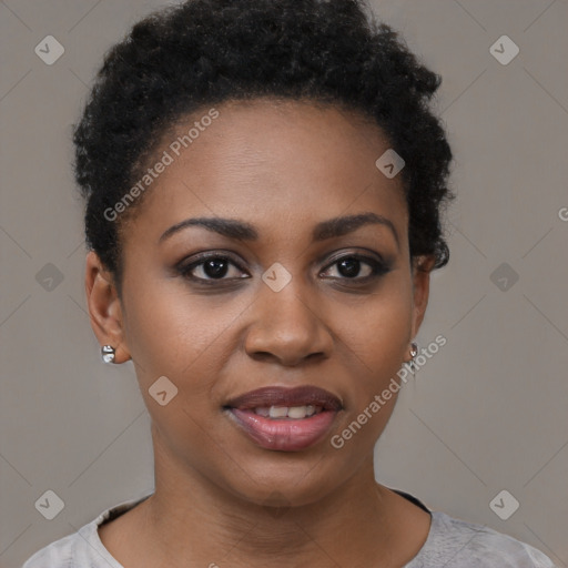 Joyful black young-adult female with short  black hair and brown eyes