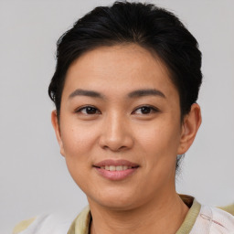 Joyful asian young-adult female with short  brown hair and brown eyes