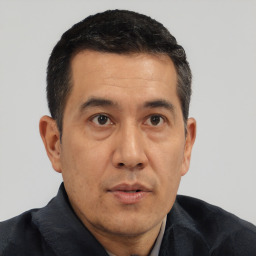 Neutral asian adult male with short  black hair and brown eyes