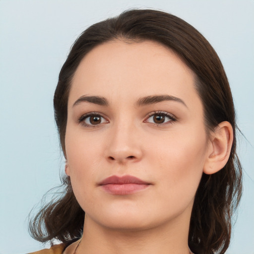 Neutral white young-adult female with medium  brown hair and brown eyes