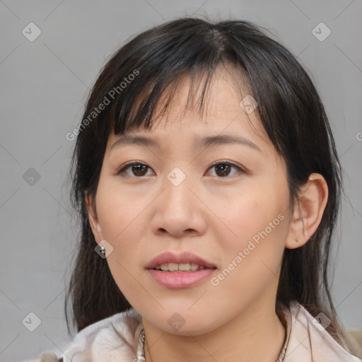 Joyful asian young-adult female with medium  brown hair and brown eyes