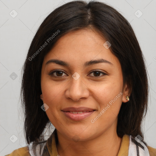 Joyful latino young-adult female with medium  brown hair and brown eyes